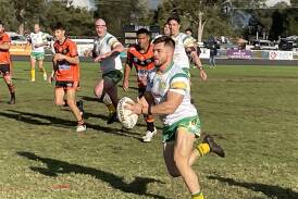 Orange CYMS take on Nyngan Tigers at a muddy Larkin Oval. Pictures by Grace Ryan