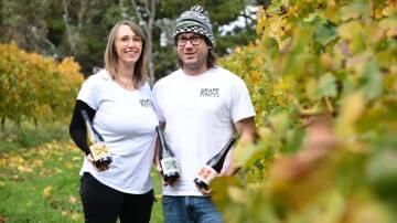 Grape Pirates Wines owners Rebecca Milne and Aaron Onegin-Ward in a vineyard they've been managing for their new label. Picture by Jude Keogh