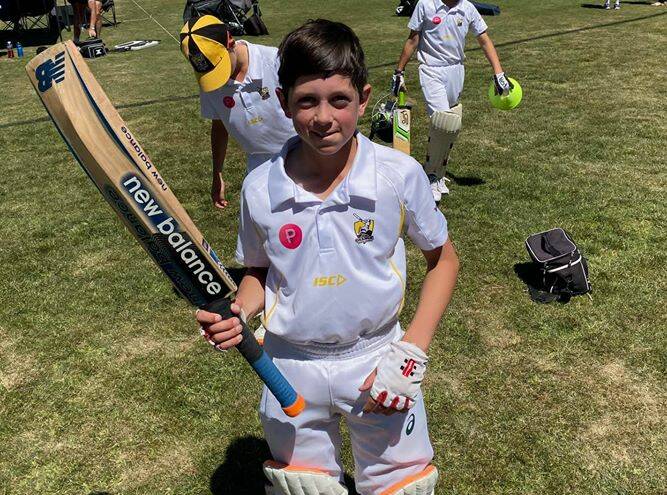 BREAKTHROUGH: Ollie Brincat raises his bat after scoring his maiden half century on Sunday, one which inspired Orange's under-12 win over the Blue Mountains. Photo: CONTRIBUTED