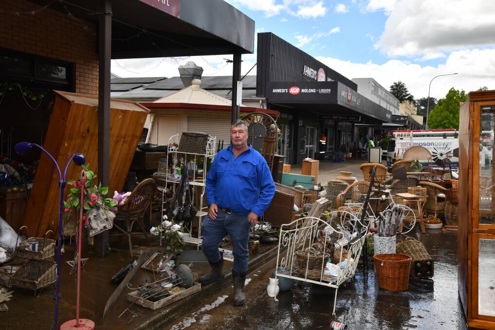 Cabonne Shire mayor Kevin Beatty stands among damaged business goods on Bank Street, Molong. Picture by Carla Freedman