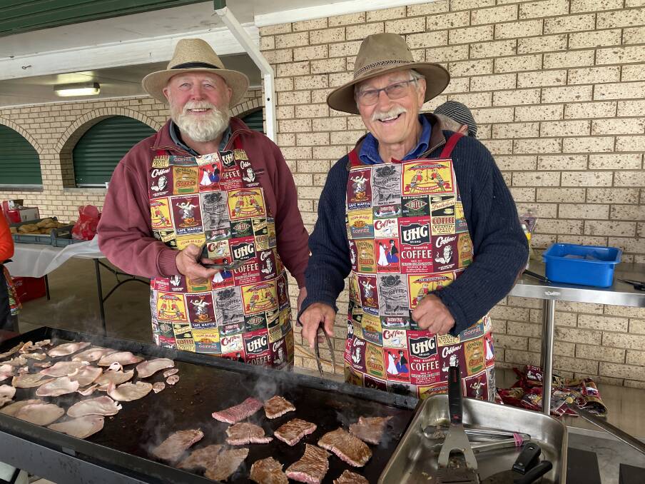 Molong Advancement Group (MAG) had three BBQs going as patrons eagerly lned up. Picture by Dominic Unwin