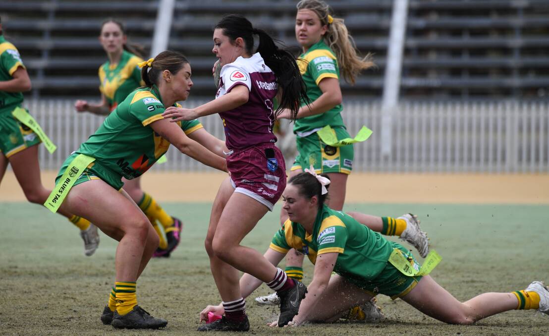 Kiara Sullivan attempts to evade a tag at Wade Park. Picture by Jude Keogh