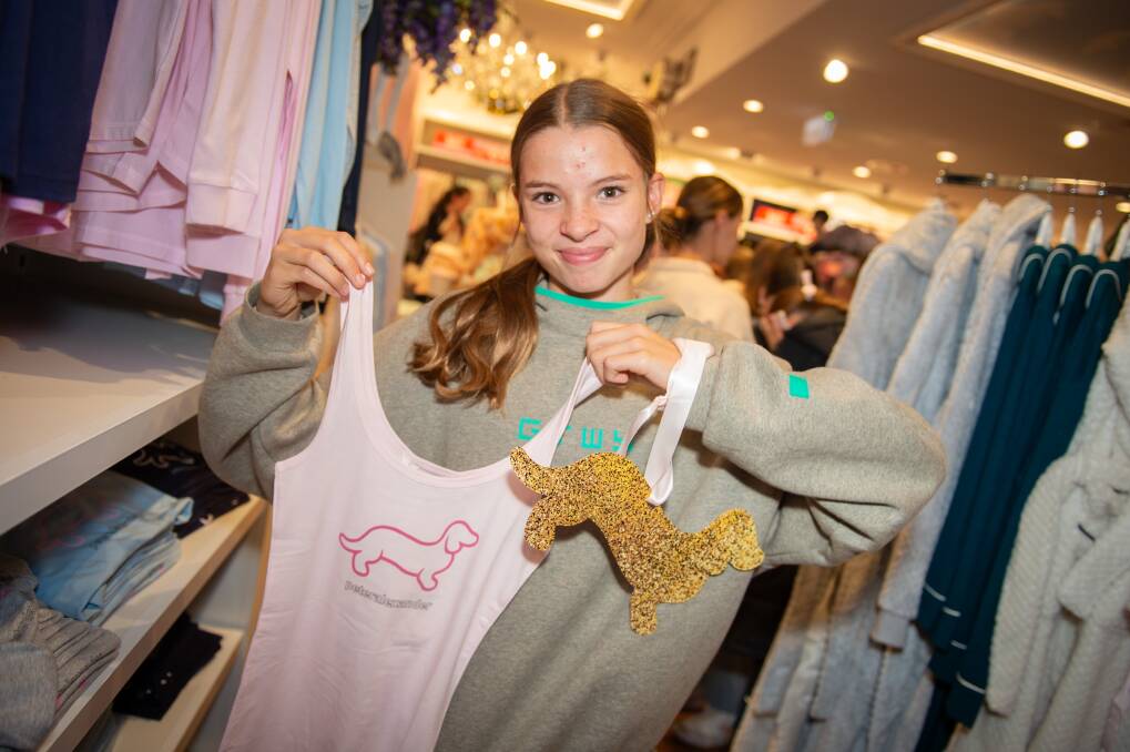 Bathurst resident Bella Crawford with her golden dachshund and one of the tops she liked at the launch of Peter Alexander Bathurst on June 10, 2024. Picture by James Arrow