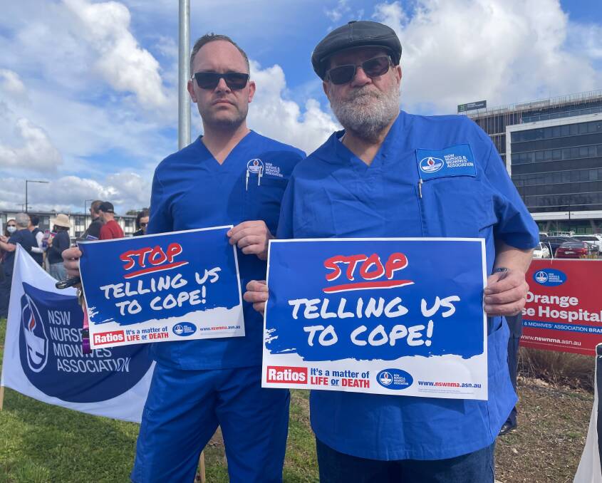 President and vice president of the NSWNMA Mid-Western branches, nurses Mathew Grant and Wayne Ozols in Orange during Thursday's strike, September 1. Picture by Emily Gobourg.