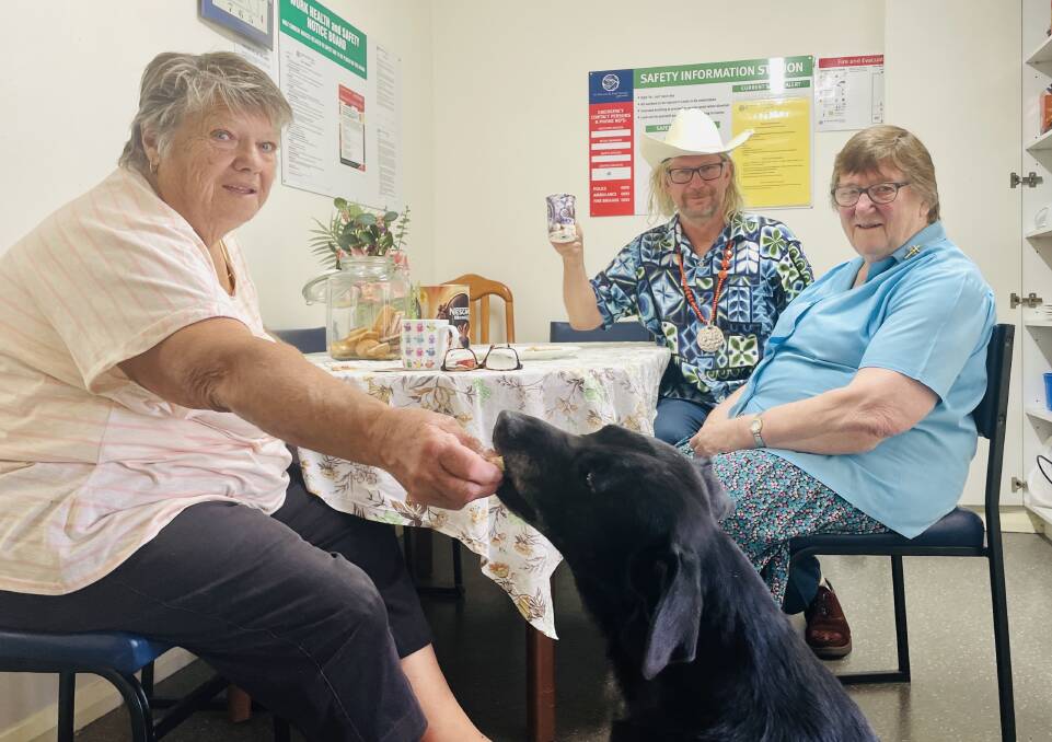 Molong Vinnies volunteers Kathy Neville with 'Triple A' pass, Zoe the dog and her owner Tim Oxley with Sister Francis enjoying a cuppa on Wednesday. Picture by Emily Gobourg.