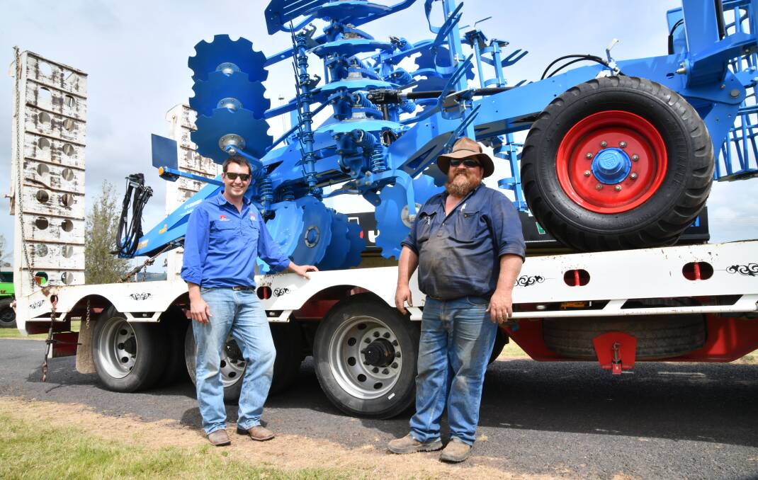 JGW harvest's Lyndal Diller with DMS Transhaul's Dallas Smith on Tuesday, setting up for this week's Australian National Field Days. Picture by Carla Freedman.