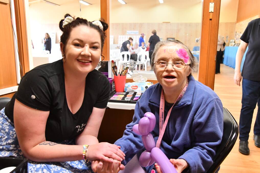 Emily Harmer of Em's Fancy Faces with a very pleased Shirley Clyde, each celebrating Wangarang's 60th anniversary on Wednesday. Picture by Carla Freedman.