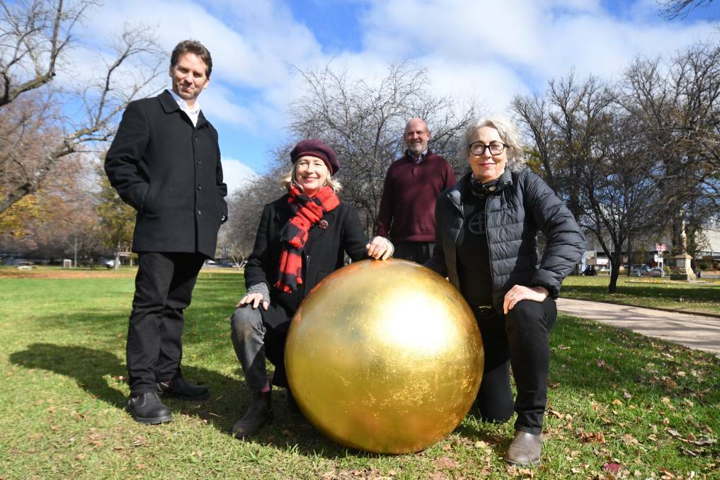 2022 installation of the Shadowline 'Gold Balls' in Orange with Orange Regional Gallery Director Bradley Hammond, Orange City Council Mayor Jason Hamling, and artists Julia Davis and Lisa Jones. Picture supplied. 