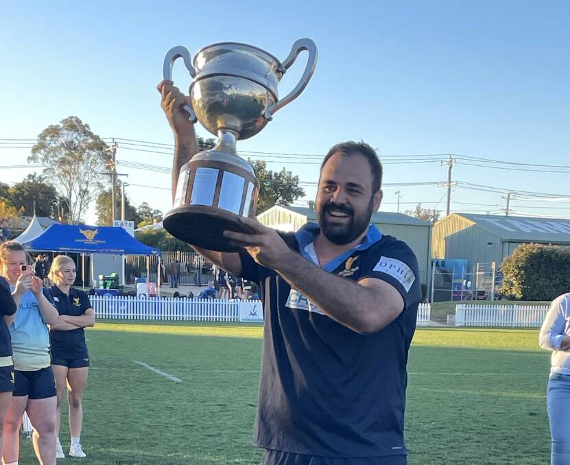 Central West skipper Peter Fitzsimmons holds up the Caldwell Cup. Picture by Samantha Newsam