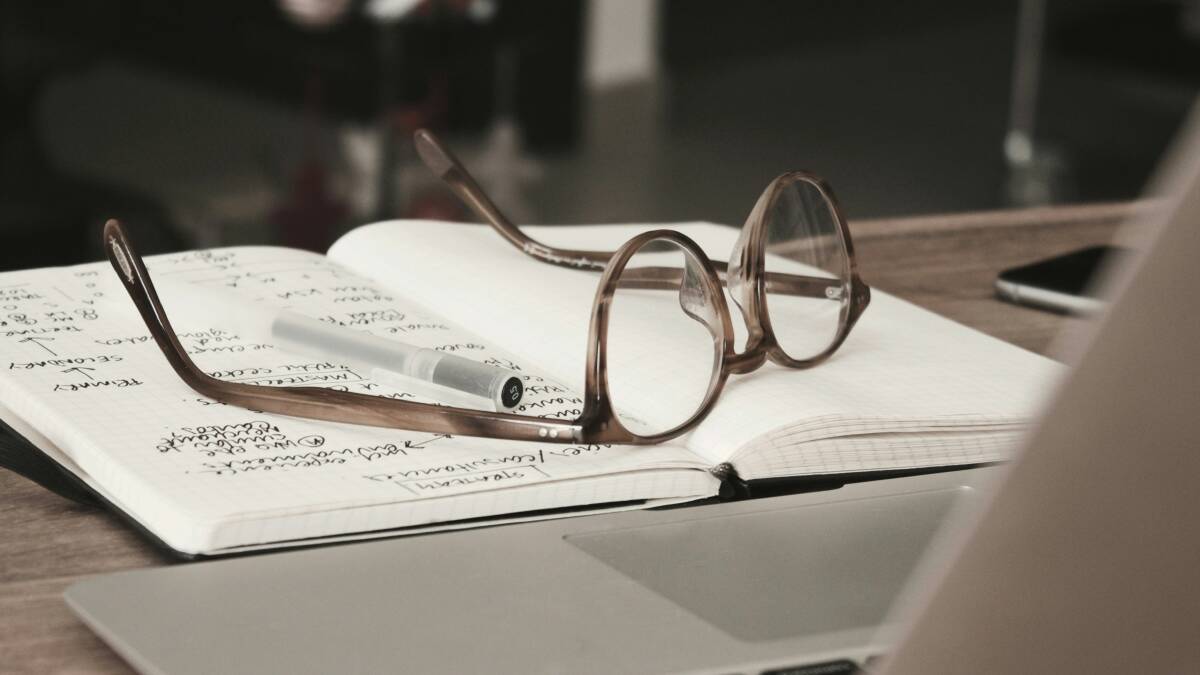 Glasses on a book. Picture by Dan Dimmock from Unsplash