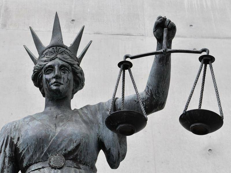 A statue of Lady Justice holding a set of scales. File picture