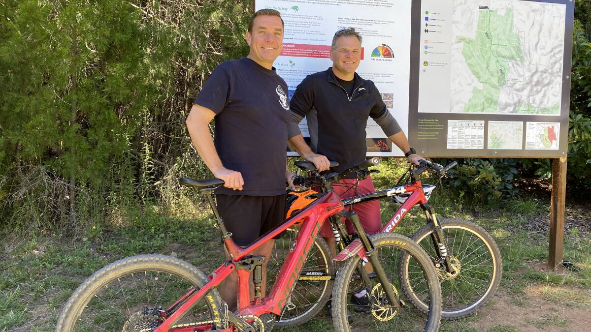 Phil Donato (right) with his SFF colleague Roy Butler (left) at the Galinbundinya mountain bike trail-head. Picture supplied.