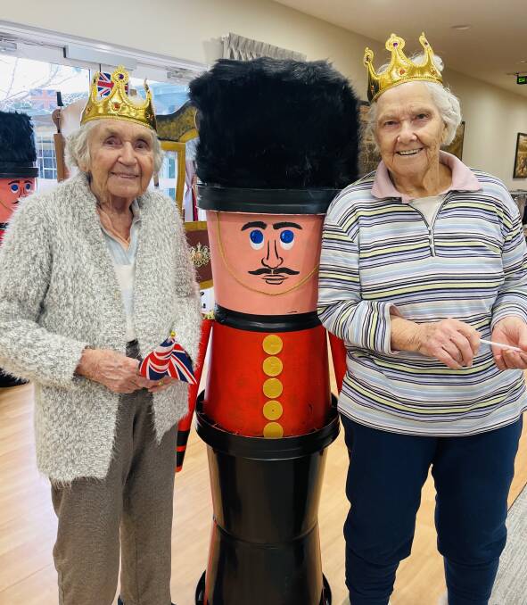 Yvonne Protheroe and Emily Standing with a guardsman who was created as part of the Queen's Jubilee celebrations. Picture supplied.