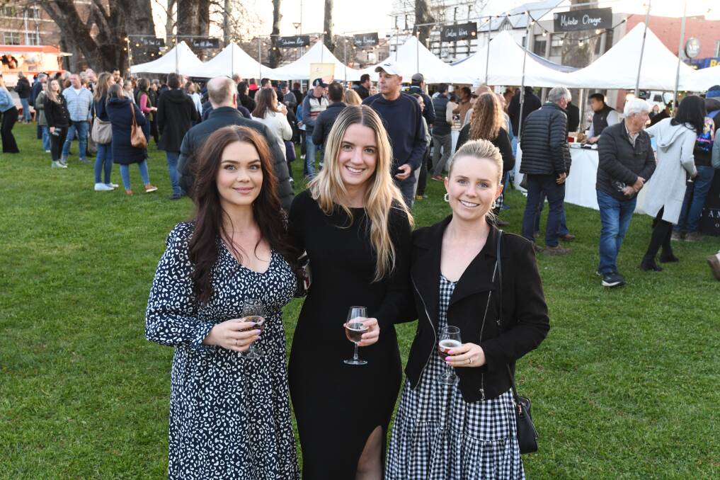 Caylee Pope, Kate Philpott, kate Hessel arrived early at the Orange Wine Festival Night Market on Friday. Picture by Jude Keogh