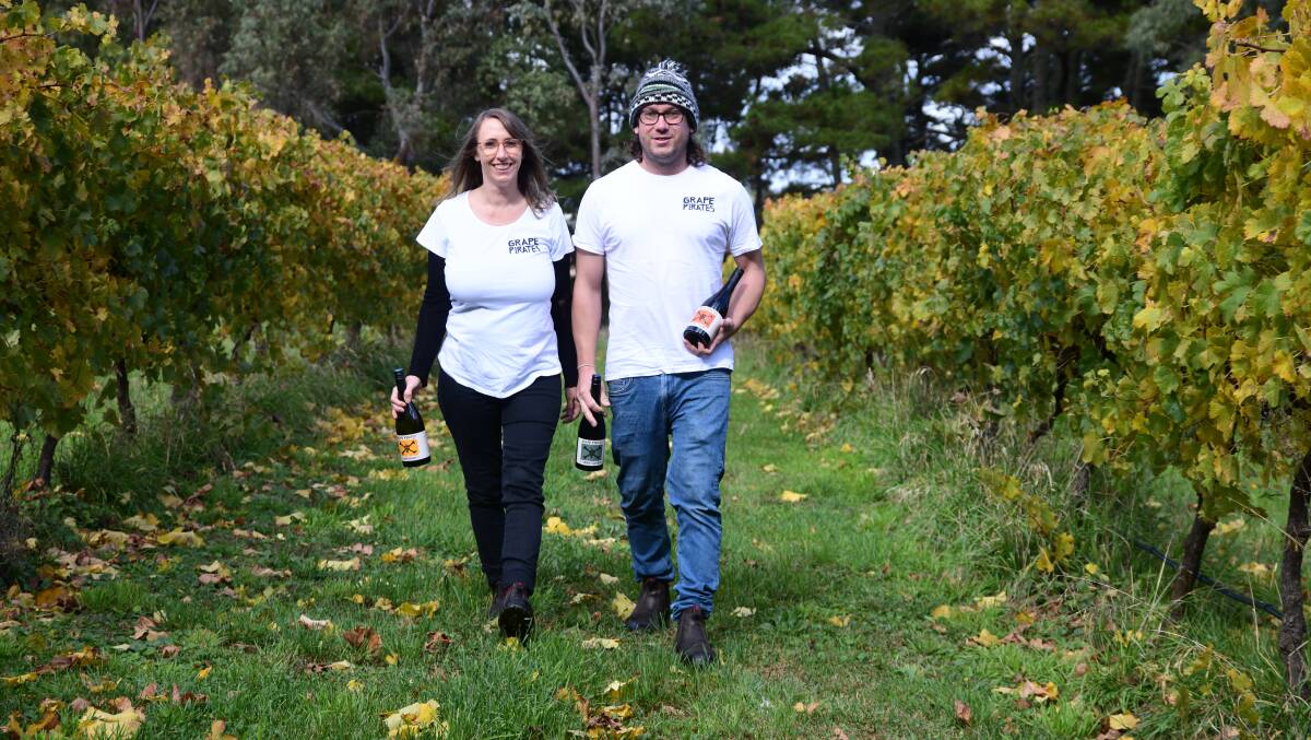 Grape Pirate Wine owners Rebecca Milne and Aaron Onegin-Ward in a vineyard from where they've been sourcing grapes. Picture by Jude Keogh