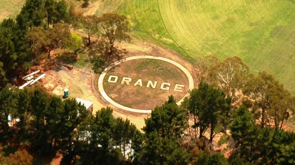 The Orange sign at Sir Jack Brabham Park is a relic of the former airport and won't be moved when the new stadium is built.