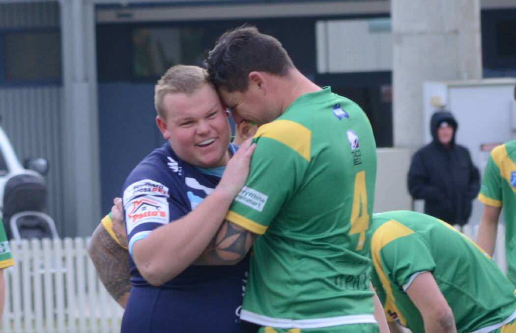 Hawks prop Toby Collins with a few words to say to Orange CYMS skipper Ed Morrish. Picture by Riley Krause