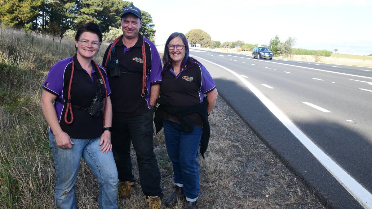 Jackie Clark, Luke Sweet and Louise O'Brien from Petcare Extraordinaire are pleased that work has commenced on the Mitchell HIghway near their work. Picture by Jude Keogh