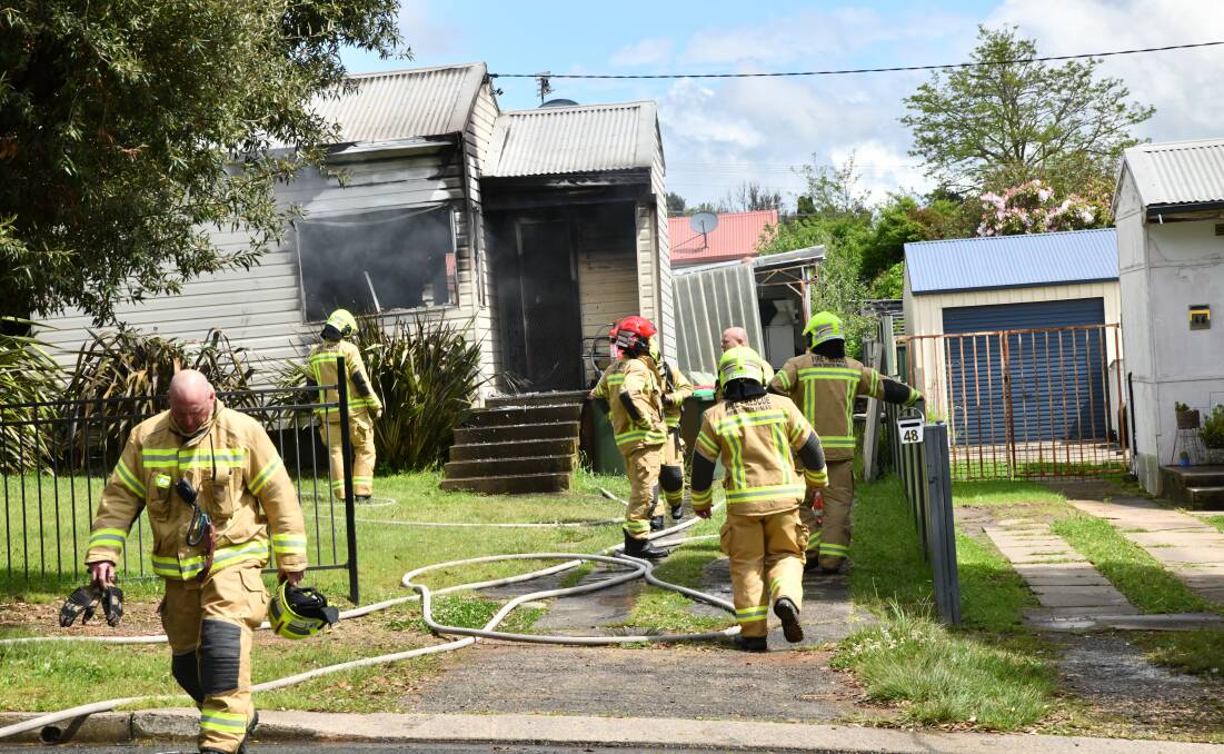 Firefighters working to extinguish the house fire in Churchill Avenue. Picture by Carla Freedman.