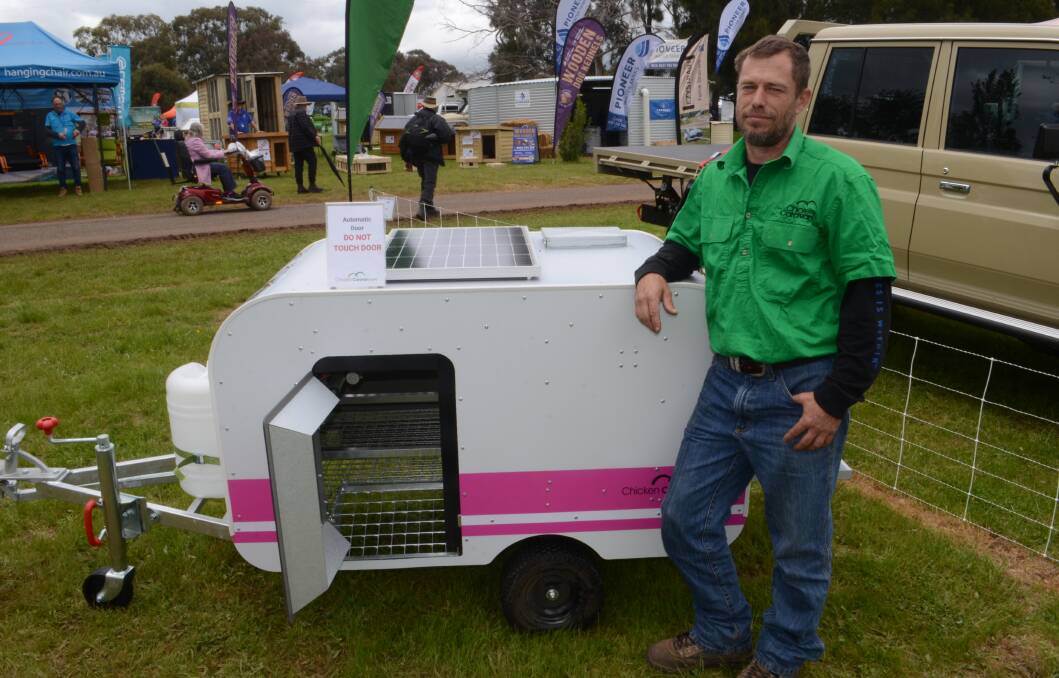 Brad Coghlan showing off the ten-chicken caravan at the Australian National Field Days. Picture by Riley Krause.