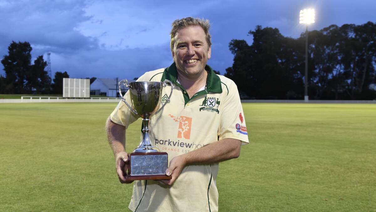 Orange City third grade captain Mick Evans proudly showing off his side's trophy. Picture by Carla Freedman.