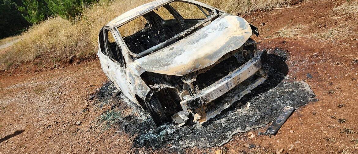 The car that was found burnt out in the forest near Four Mile Creek. Picture supplied.
