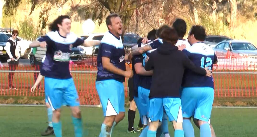 Jason Splithof (second from the left) celebrates with his team after the final whistle blew.