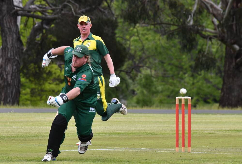 Orange City wicket-keeper Tim Hunt looks to chase the ball down as CYMS batter Dave Neil watches on. Picture by Carla Freedman.