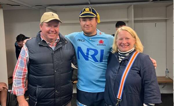 Hunter Ward (middle) with his mum and dad after making his debut for the NSW Waratahs. Picture supplied.