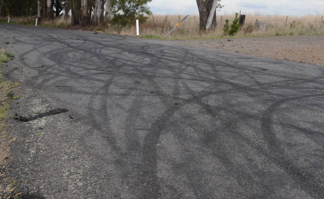 The skid marks left on the road by the drivers.