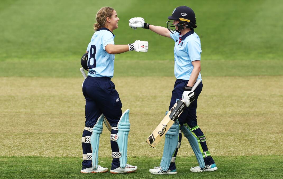 Phoebe Litchfield celebrates with teammate Tahlia Wilson after scoring her first WNCL century. Picture by Getty Images/Matt King.