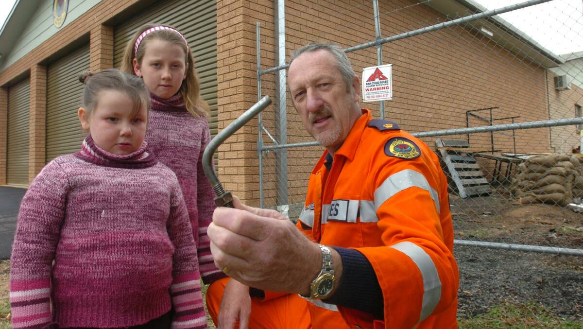FLASHBACK: Orange SES controller Kim Stevens in 2005 with granddaughters Jessica and Nicole Smith. Photo: STEVE GOSCH 