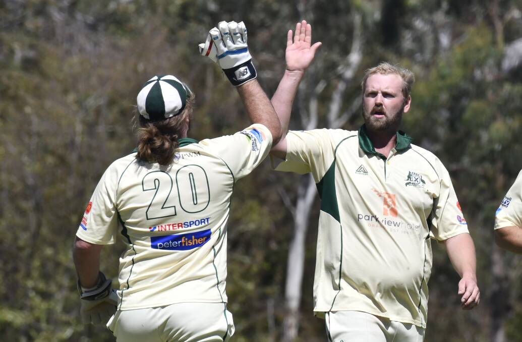Glenn Robinson and wicket-keeper Tim Hunt celebrated plenty during the year. Picture by Jude Keogh.