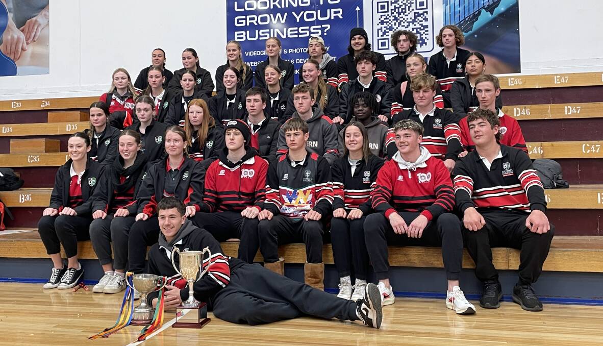 Dubbo's year 12 athletes pose with the cups. Picture by Alexander Grant