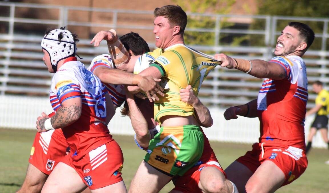 Orange CYMS' Dylan Kelly powers through the Mudgee Dragons defence in round one of this season. Picture by Jude Keogh