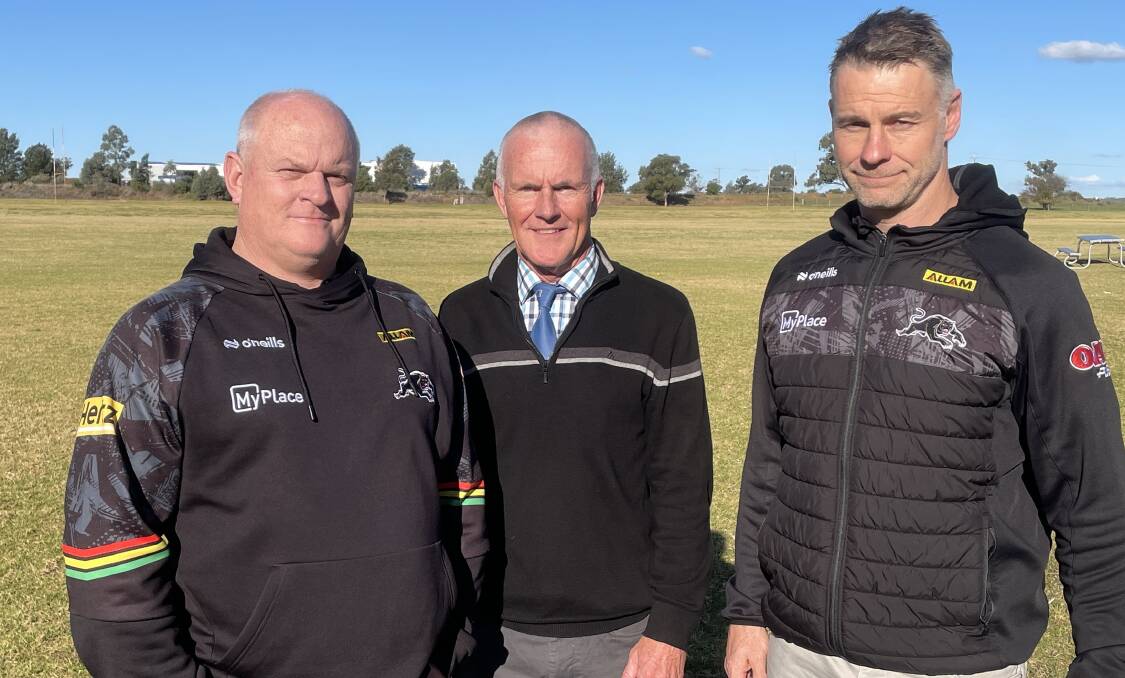 Matt Cameron (left) and Shane Elford (right) of the Penrith Panthers with St John's College teacher Andy Haycock. Picture by Nick Guthrie