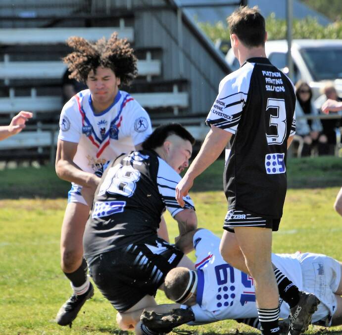 RISING STAR: Malakai Folau, pictured making a tackle in the under 18s twin town derby between Parkes and Forbes, has been selected in the Panthers Harold Matthews squad. Photo: JENNY KINGHAM.