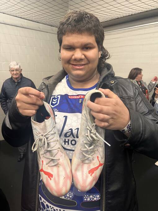Arky Bennett with Josh Addo Carr's boots from his 150th NRL game. Picture supplied 
