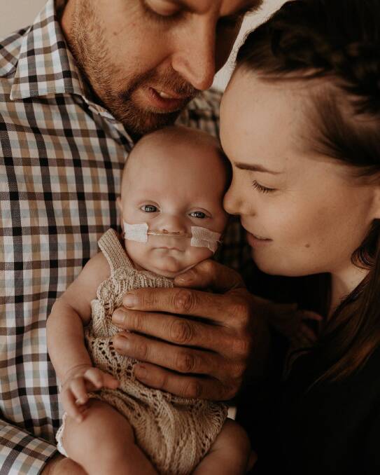 MIRACLE: Baby Henry O'Brien, with his parents Garry and Lou, was born at 25 weeks after Lou was identified as a high-risk pregnancy and relocated to RMHC Orange. Photo: Supplied