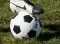 A soccer ball with a foot on it.