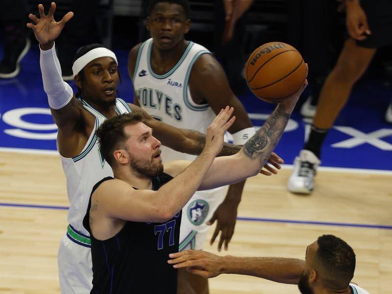 Dallas guard Luka Doncic (77) scored a game-high 32 points in the one-point win over the Wolves. (AP PHOTO)