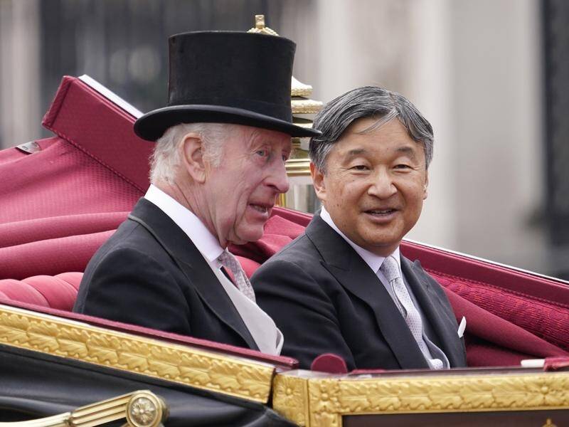 King Charles and Emperor Naruhito travelled to Buckingham Palace in a gold-edged carriage. (AP PHOTO)