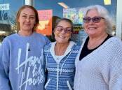 Kylie Collins, Karenne Roest and Liana Moore outside the We Care Community Shop in its final days on Wednesday, July 24 2024. Picture by Benjamin Palmer