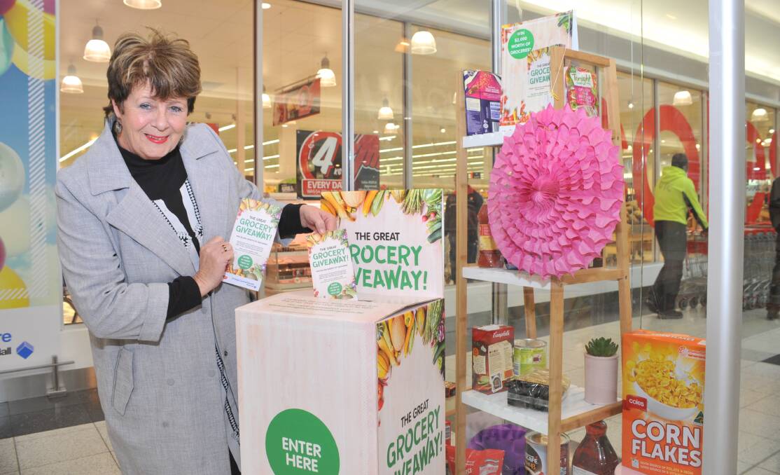 GROCERY GIVEAWAY: Orange Central Shopping Centre manager Mary Anne Blunt with an entry form for the $2000 giveaway. Photo: JUDE KEOGH 0707jkgiveaway1