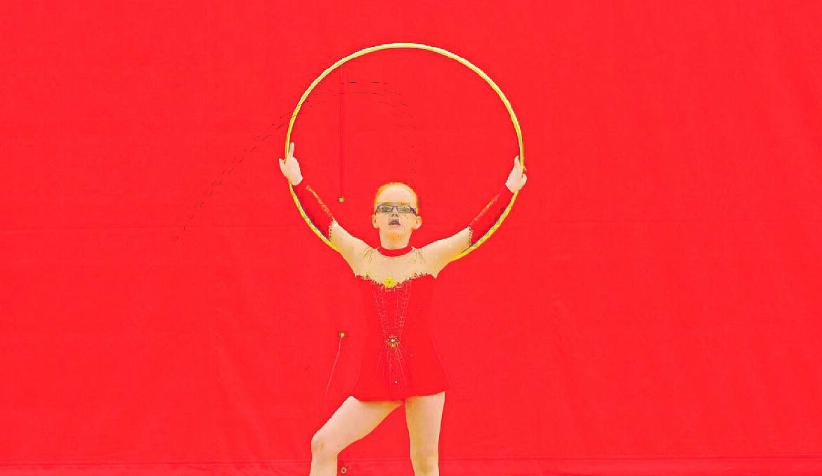 HOOPING ABOUT: Jade Semmens from Gosford gets lost in her routine at the Orange PCYC yesterday. Photo: LUKE SCHUYLER