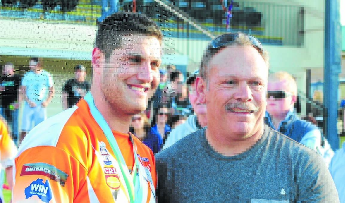 ONE OF THE BEST: Reigning Dave Scott medalist Taf Nicolas, pictured with NRL legend Cliff Lyons, is one of the Group's finest pivots.