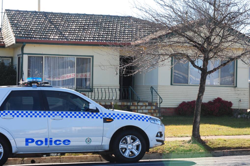 EARLY WAKE-UP CALL: Police raided a suburban house on Bathurst Road at 7am yesterday. 